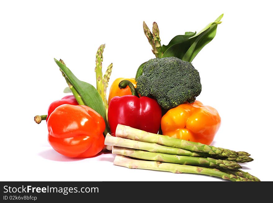 Heap of fresh ripe vegetables isolated at white background