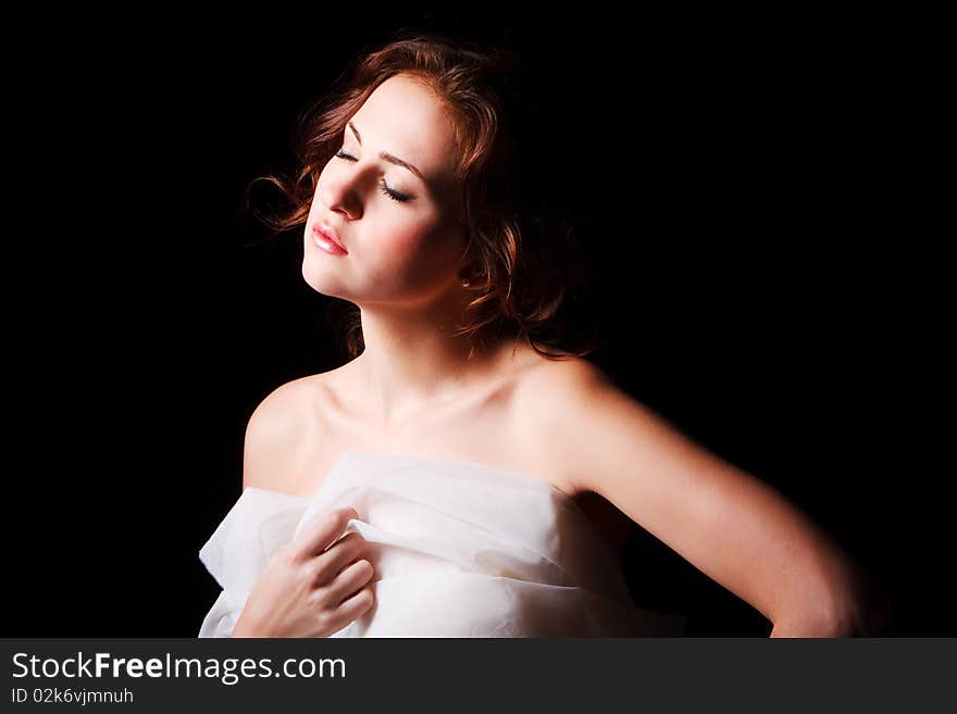 Portrait of a alluring young girl on black background. Portrait of a alluring young girl on black background.