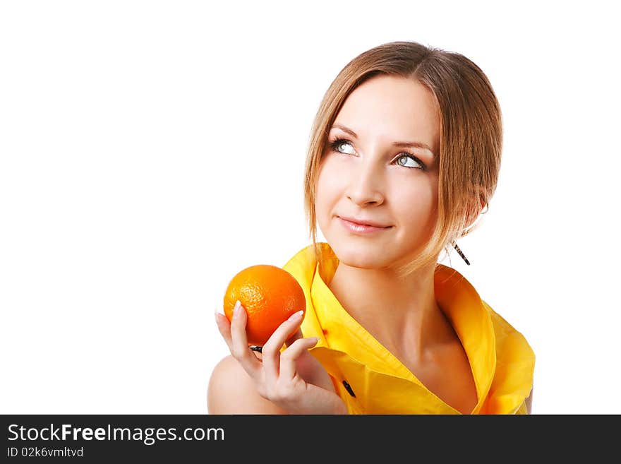 Young pretty girl in yellow dress with oranges