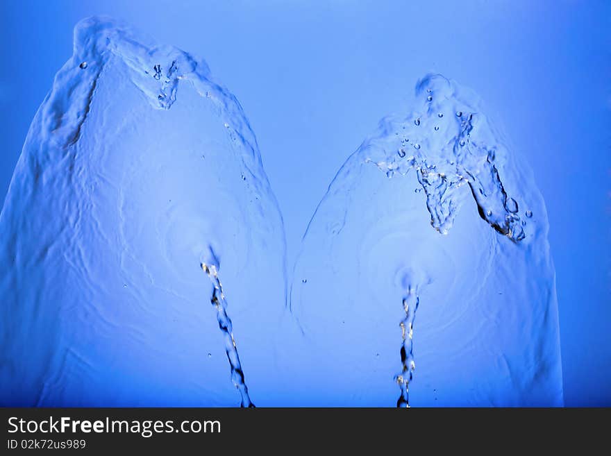 Abstract water splash which may be  used as  a background. Abstract water splash which may be  used as  a background