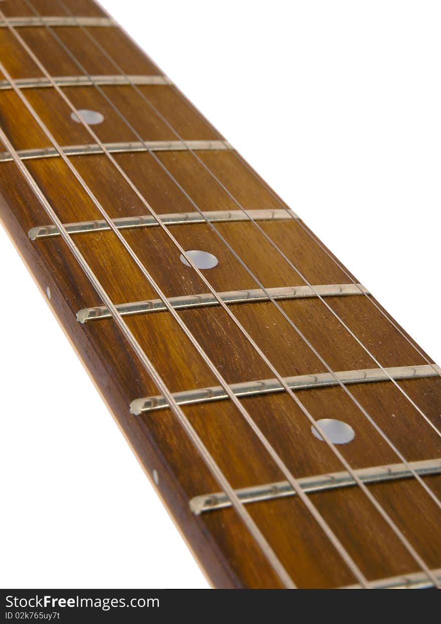 Guitar neck with strings. Close up on white background