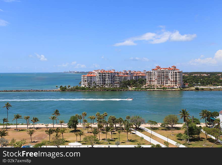 View of South Point Park, Fisher Island, and government cut waterway from South Beach in Miami, Florida. View of South Point Park, Fisher Island, and government cut waterway from South Beach in Miami, Florida.