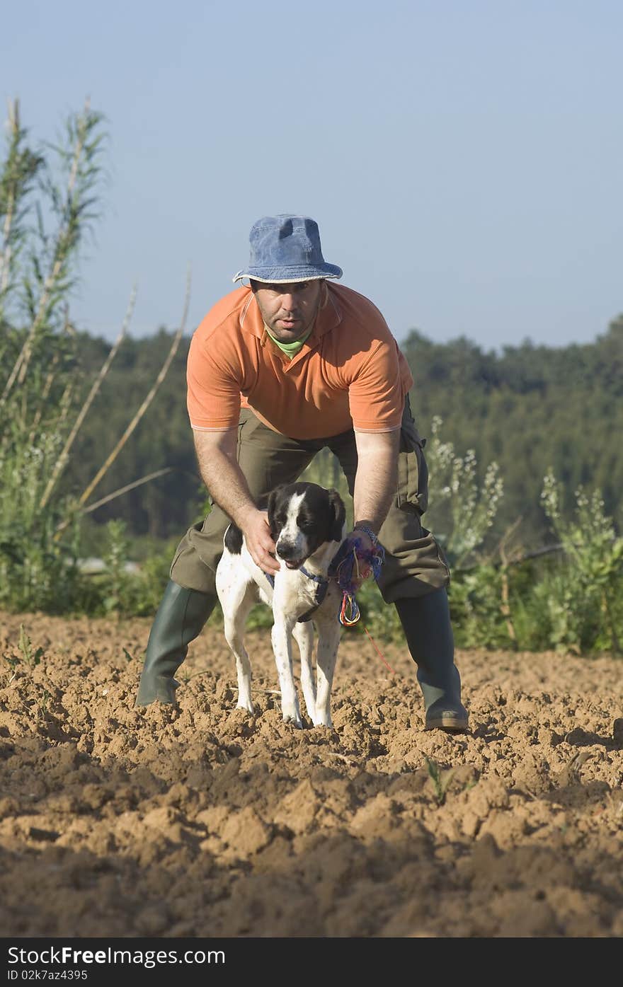 Farmer Walking With Is Dog