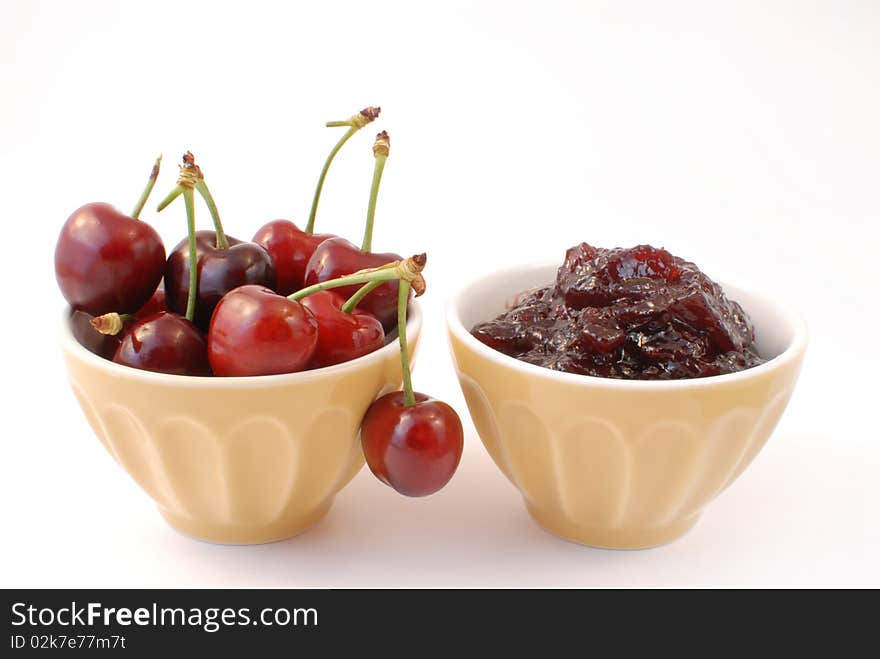 Cherries and cherry jam white background