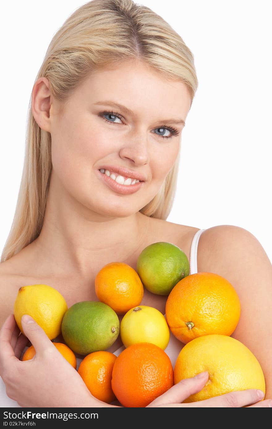 Young Woman Holding Citrus Fruit In Studio