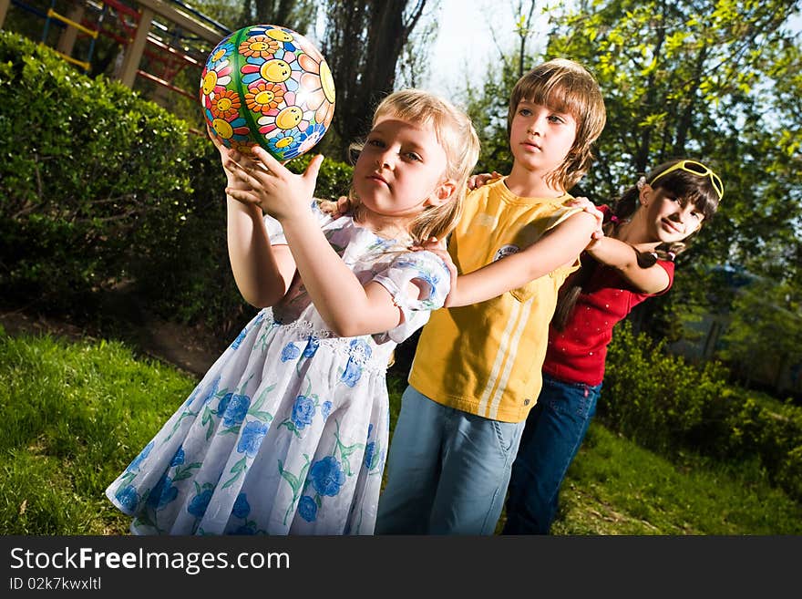 Girls with boy on walk in park