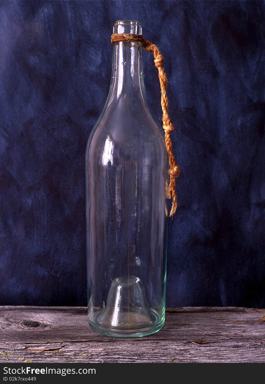 Old bottle isolated on painted background. Old bottle isolated on painted background