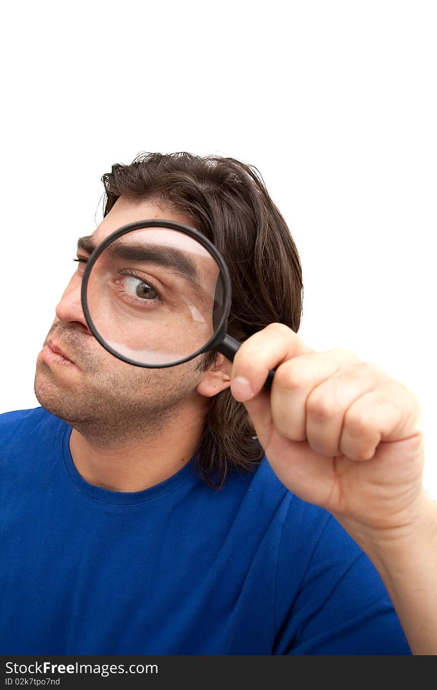 Curious man holding a magnifying glass