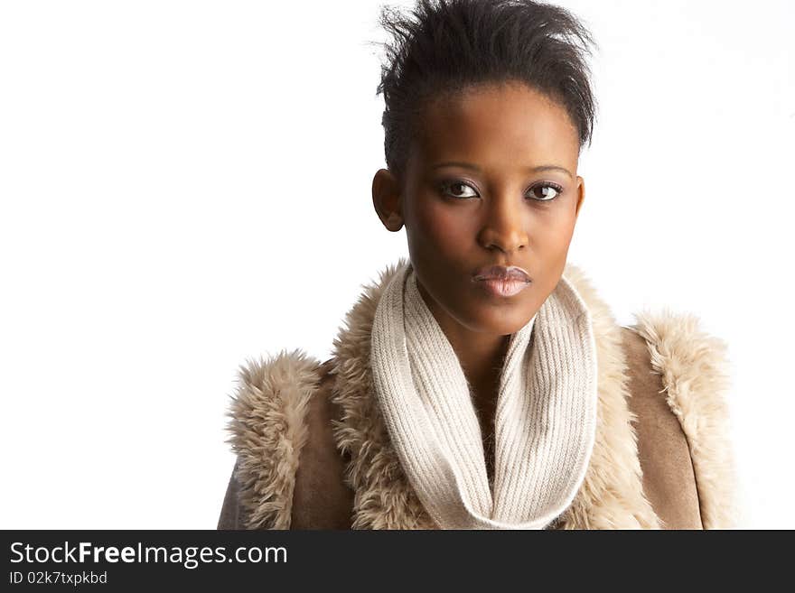 Young Woman Wearing Winter Clothes In Studio