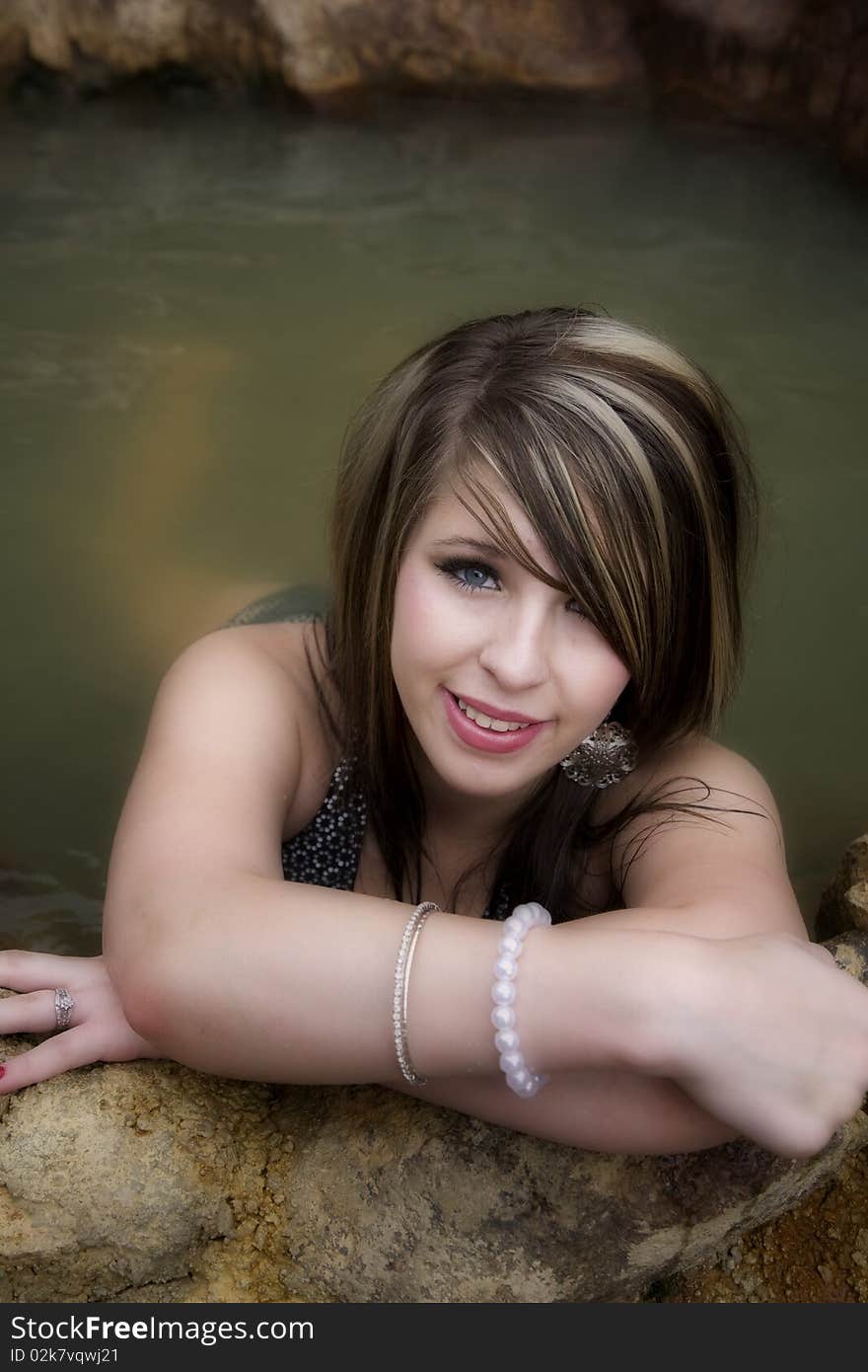 Woman Leaning On Arms In Swimsuit