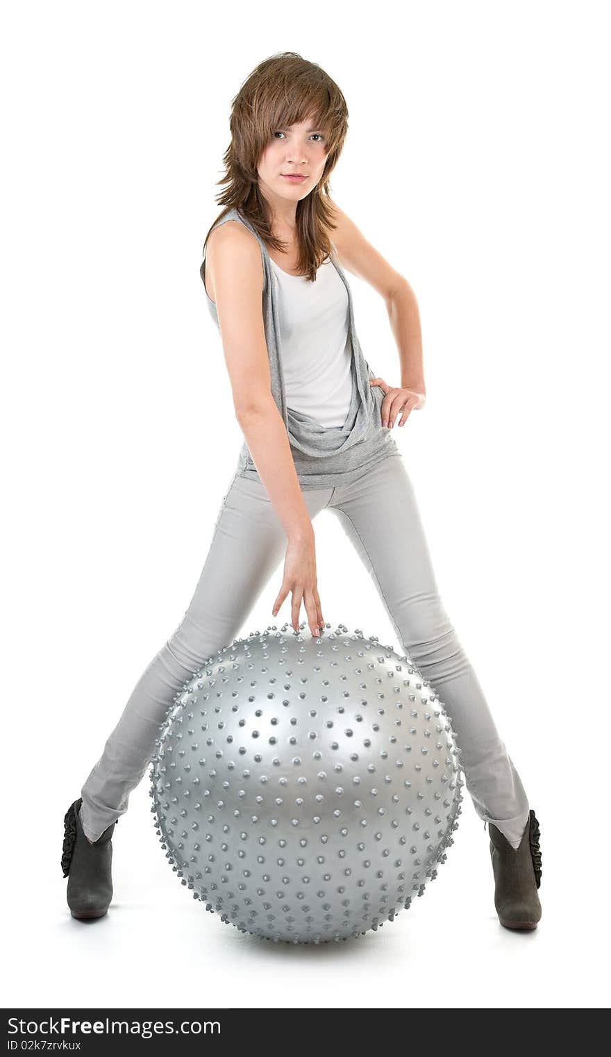 Athletic girl with a big silver ball