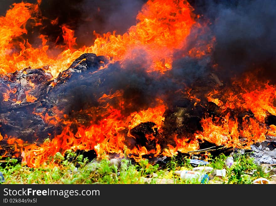 Big flames on field during fire