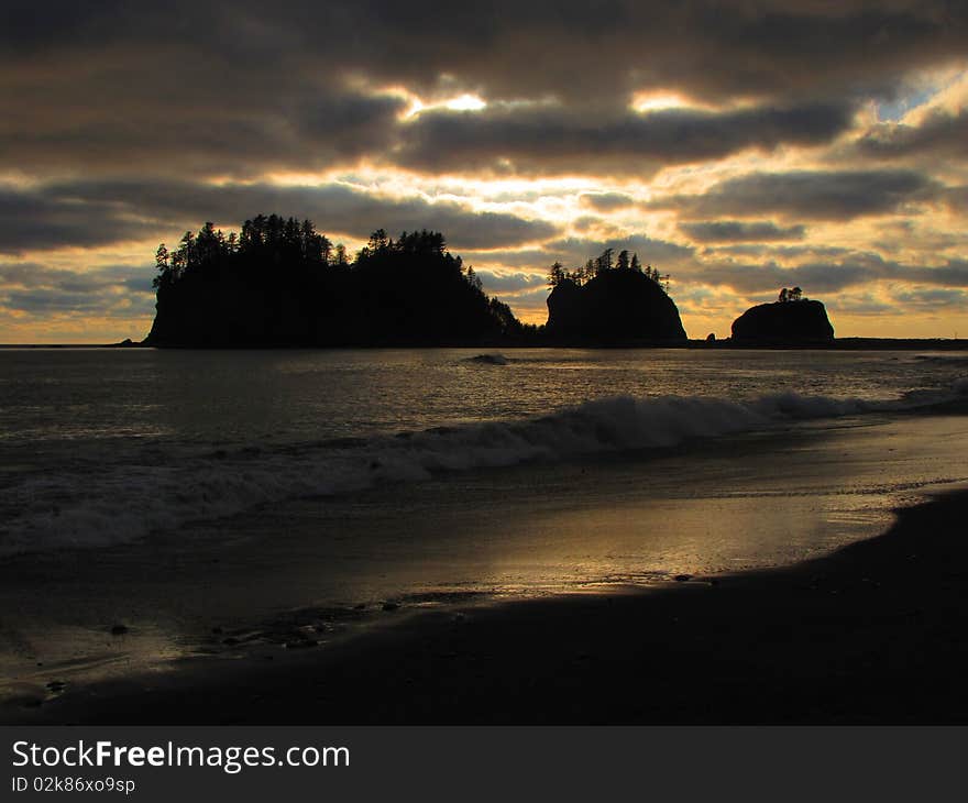 This image of the rocky outcropping and the ocean waves was taken late in the day along the Washington coastline. This image of the rocky outcropping and the ocean waves was taken late in the day along the Washington coastline.