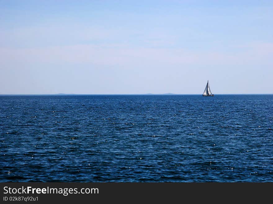 Travelling by yacht on the Adriatic sea near coast of Istra (Croatia) with islands on horizont. Travelling by yacht on the Adriatic sea near coast of Istra (Croatia) with islands on horizont.