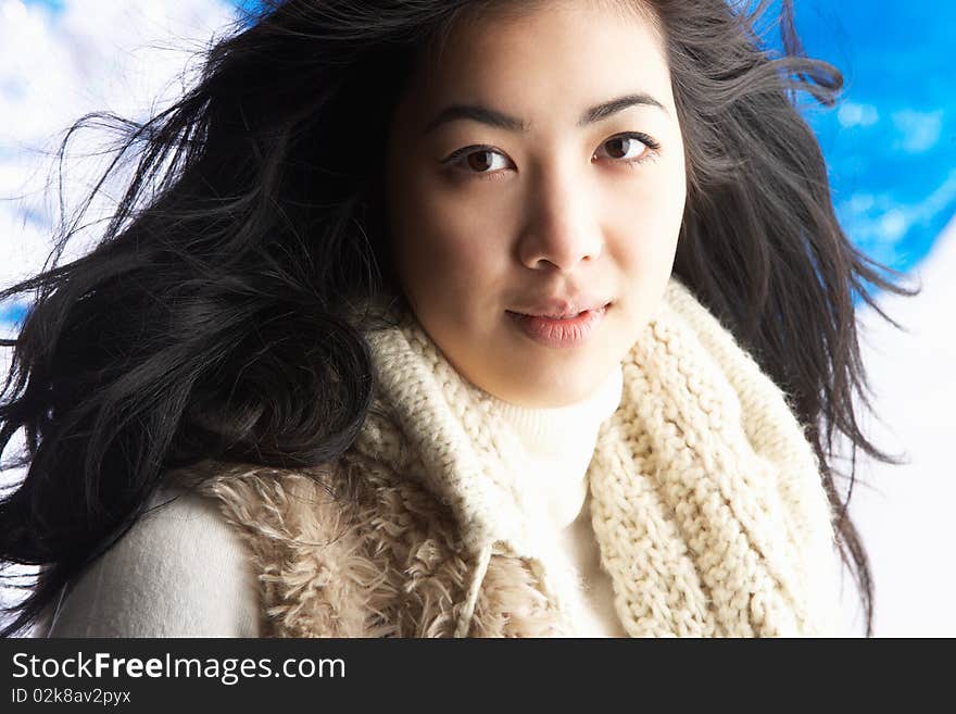 Young Woman Wearing Winter Clothes In Studio