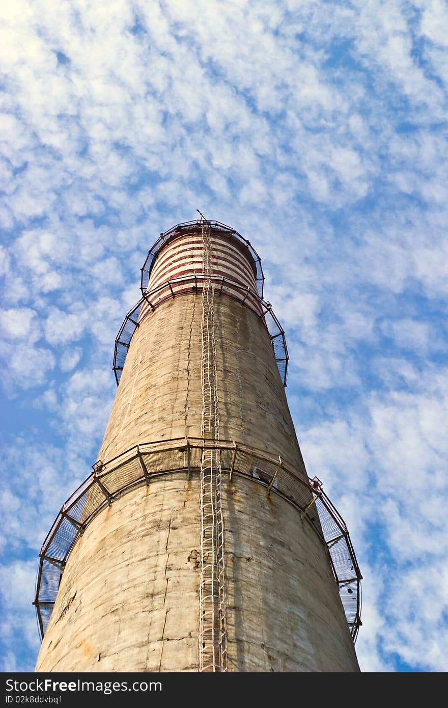 Industry chimney in a blue sky on sunny day