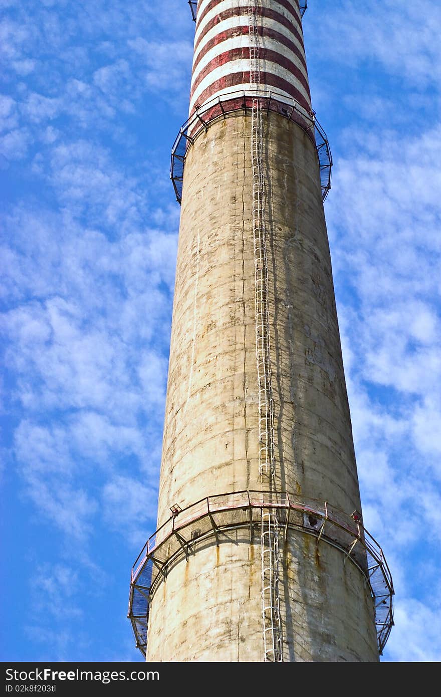 Industry chimney in a blue sky on sunny day