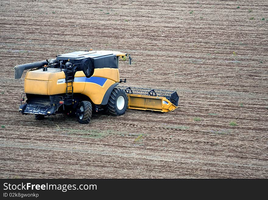 Aerial landscape with rural field and tractor at hot summer