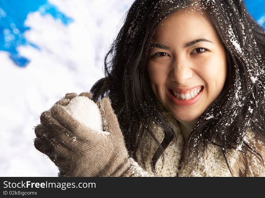 Woman Wearing Winter Clothes In Studio