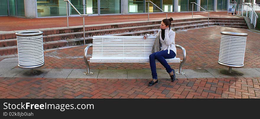 Woman Sitting In A Brench