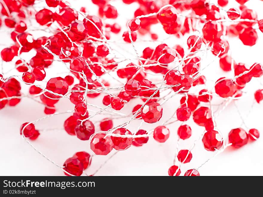 A chain with red jewels isolated on white. A chain with red jewels isolated on white