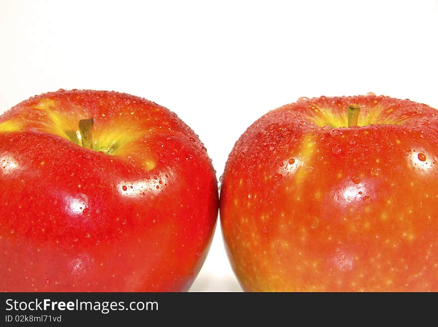 Ripe red apple on a white background