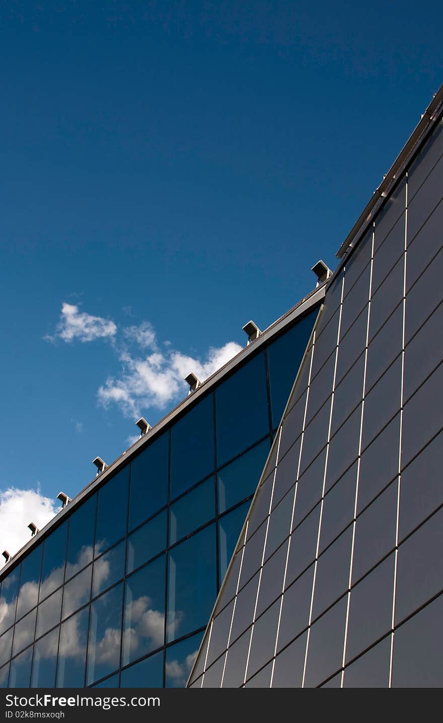 High modern building, sky and clouds. High modern building, sky and clouds