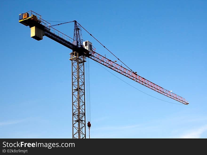 View of building crane and blue sky