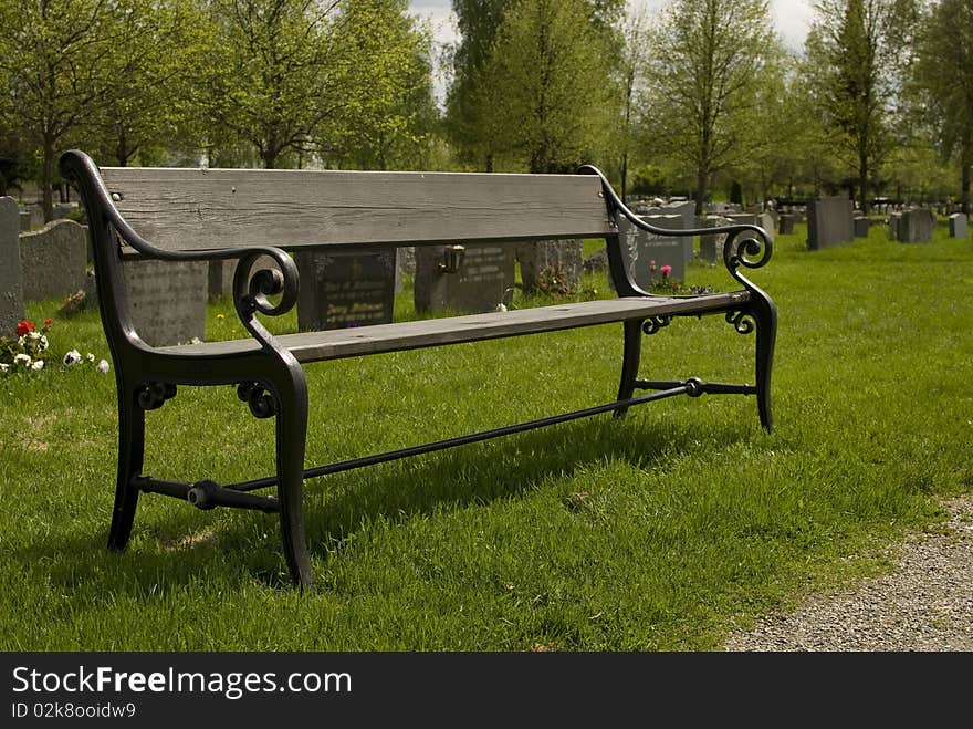 The Park Wooden Bench in old cemetery.