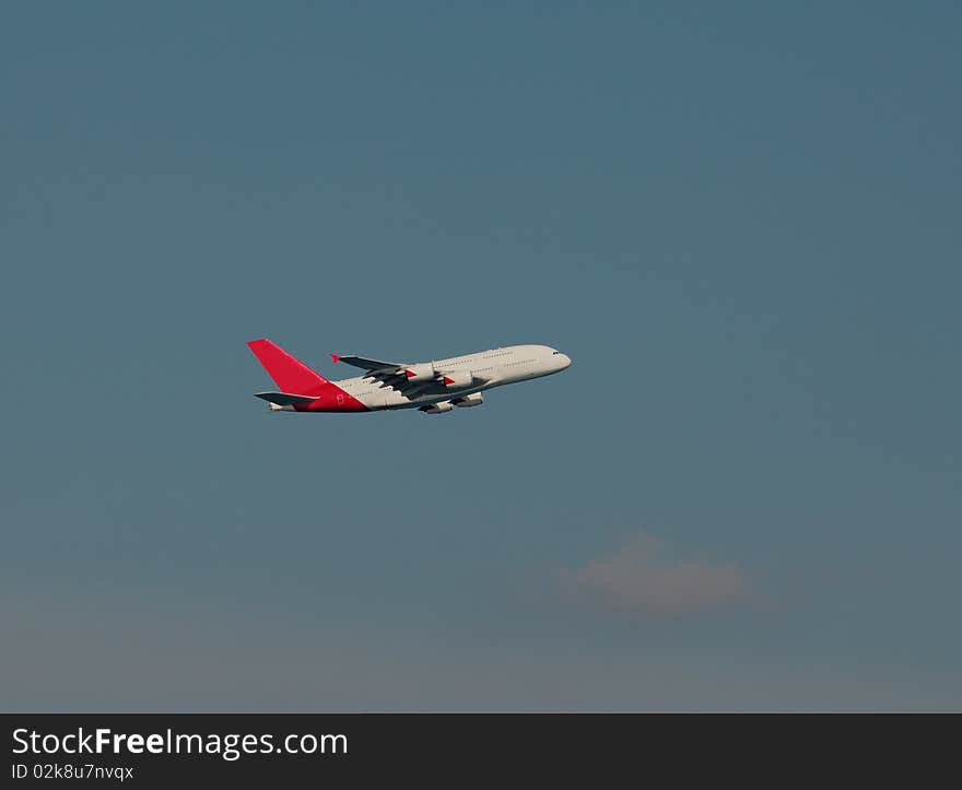 A-380 airbus in flight against blue sky