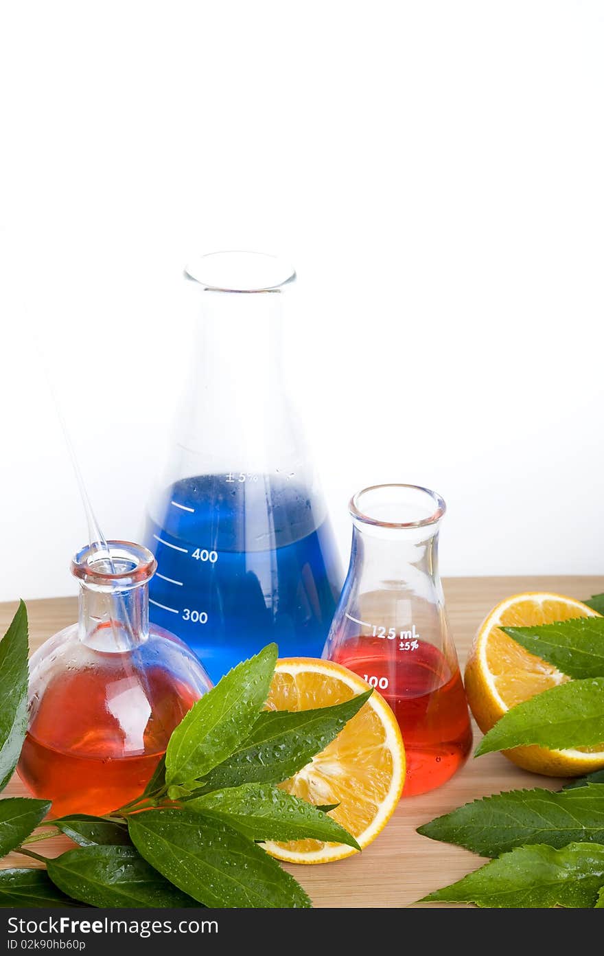 Laboratory flask and orange