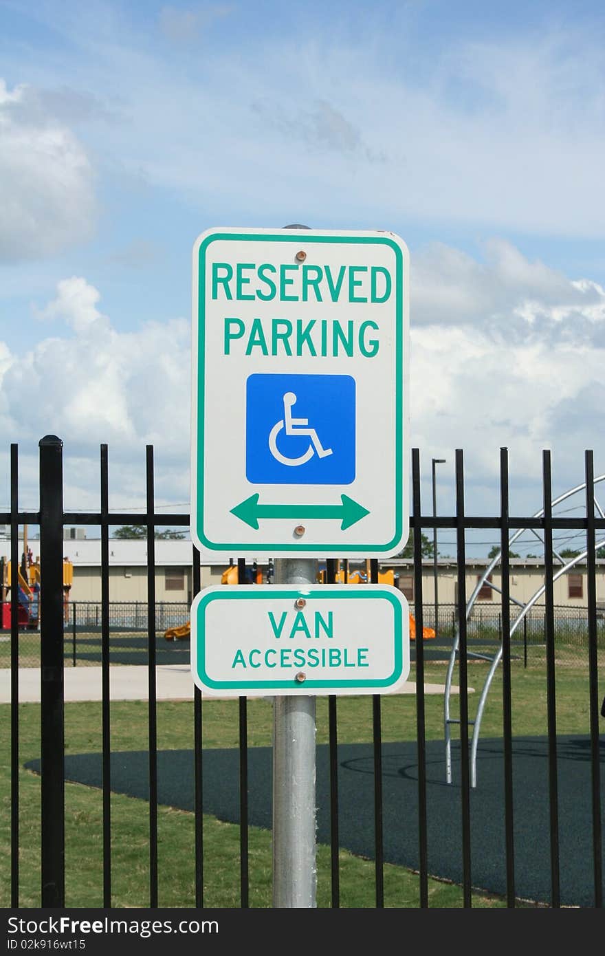 A handicapped parking, van accessible sign