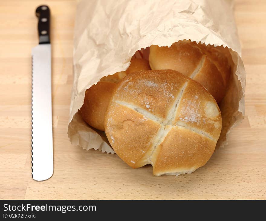 Fresh bread rolls isolated on a kitchen bench