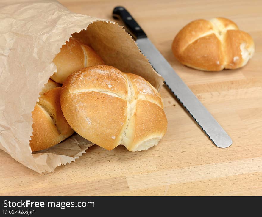 Fresh bread rolls isolated on a kitchen bench