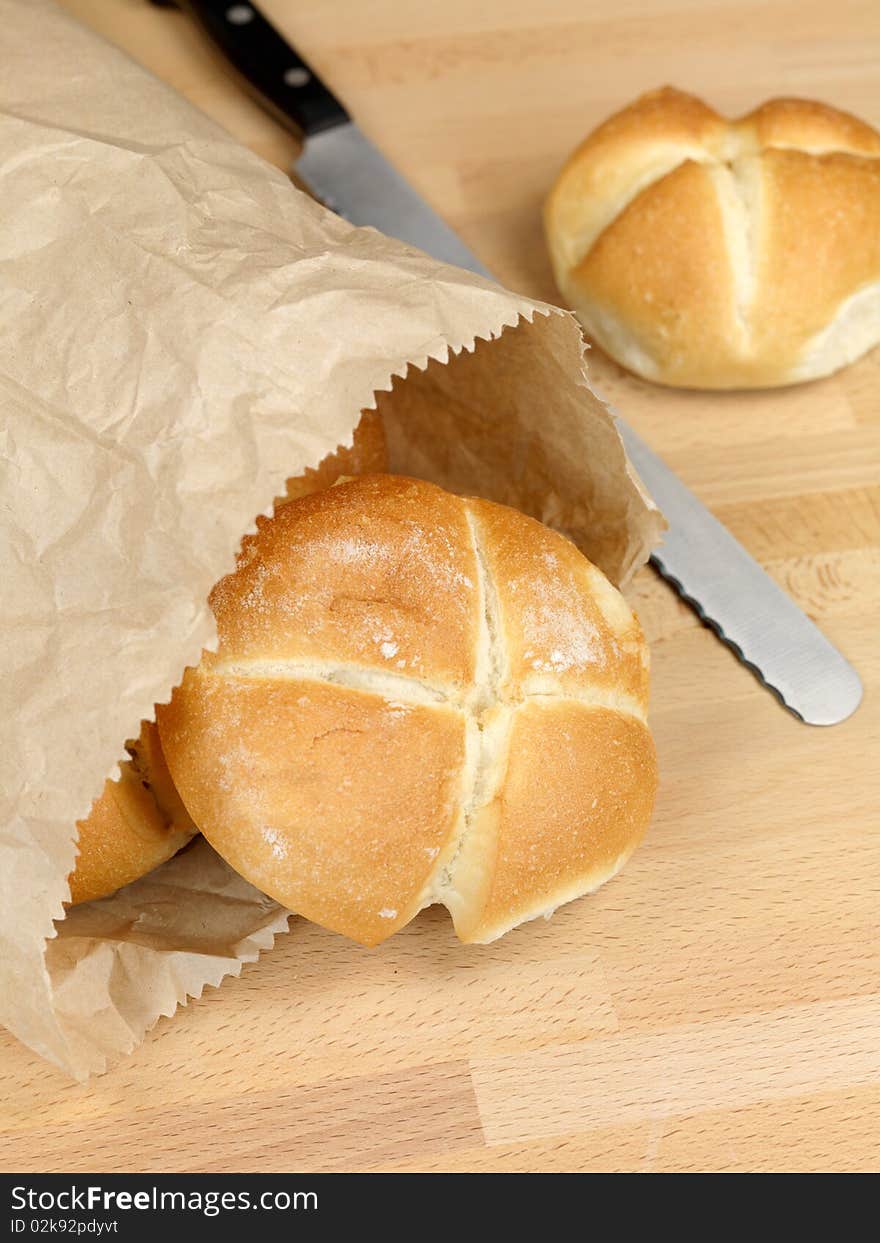 Fresh bread rolls isolated on a kitchen bench