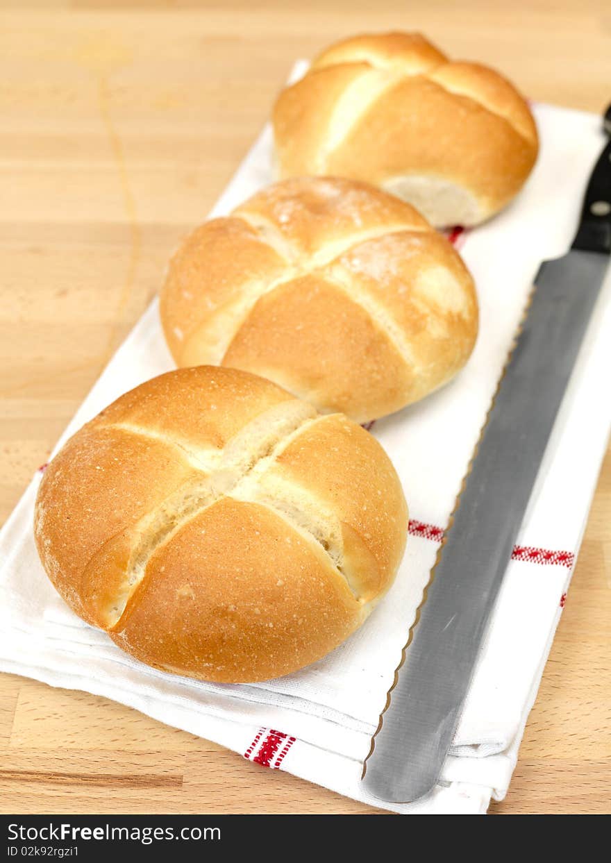 Fresh bread rolls isolated on a kitchen bench