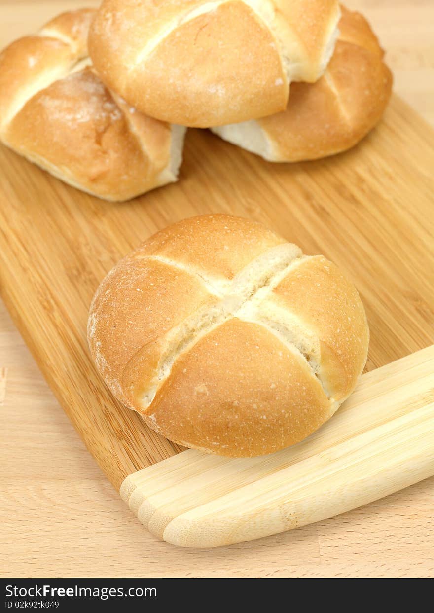 Fresh bread rolls isolated on a kitchen bench