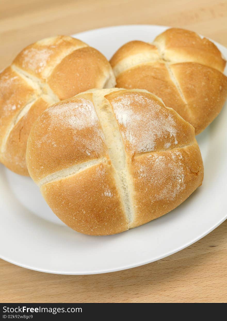 Fresh bread rolls isolated on a kitchen bench