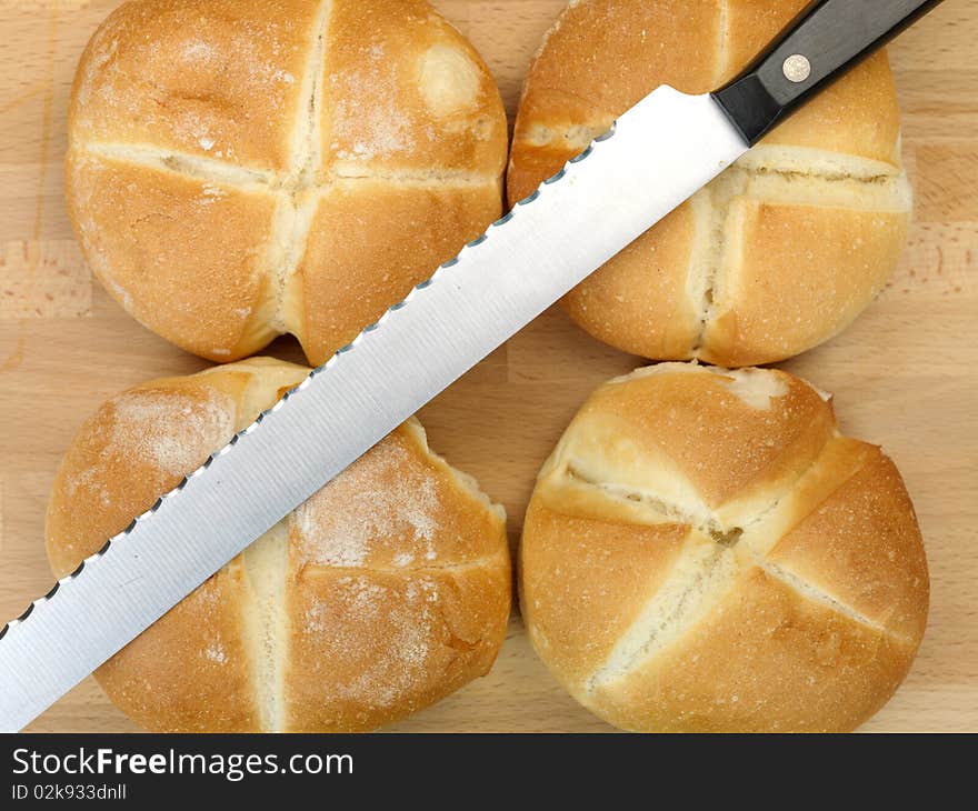 Fresh bread rolls isolated on a kitchen bench