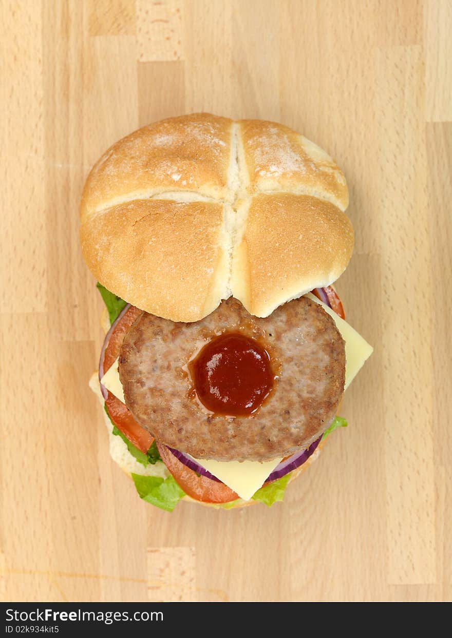 A freshly made American style hamburger with sauce