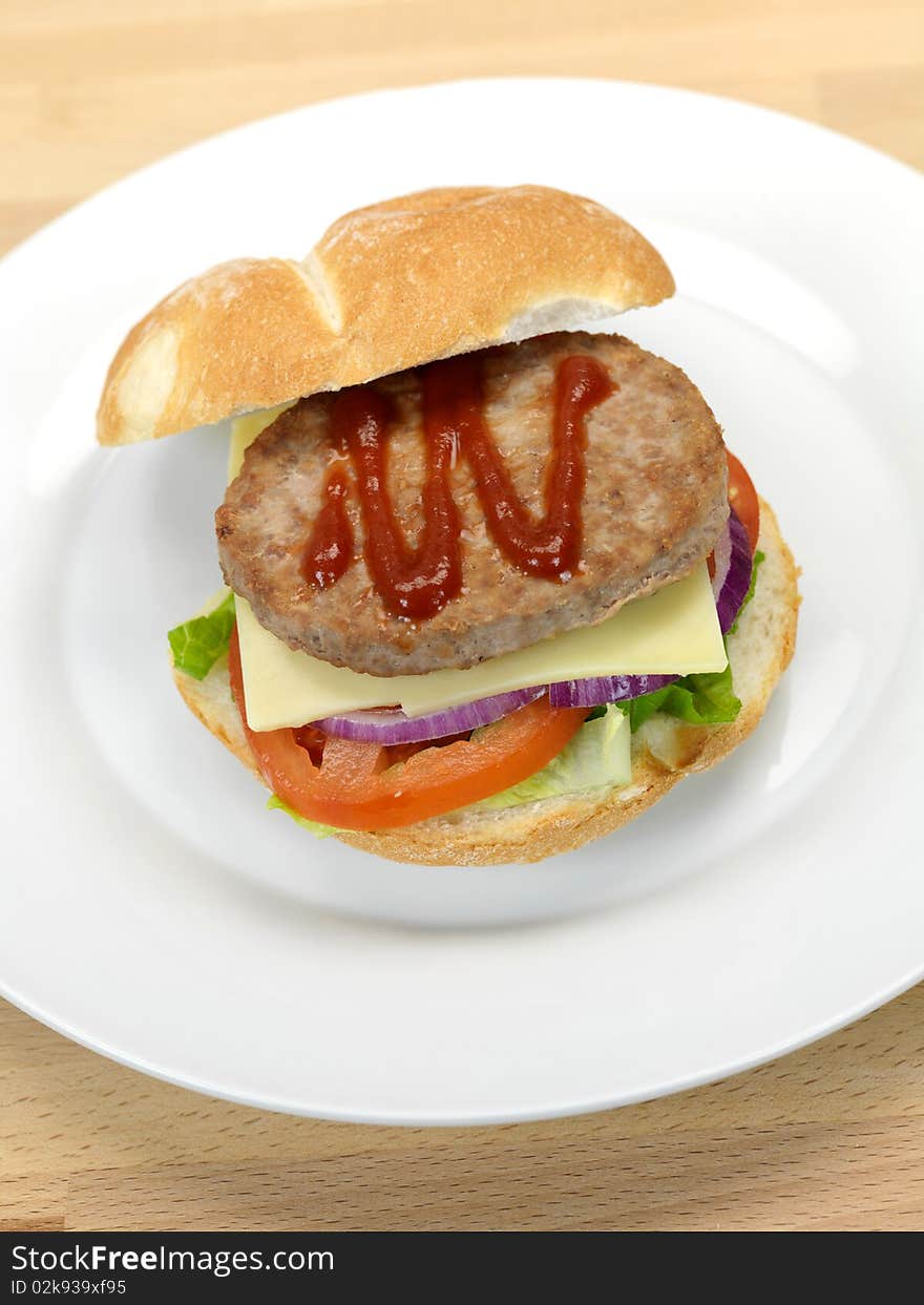 A freshly made American style hamburger with sauce