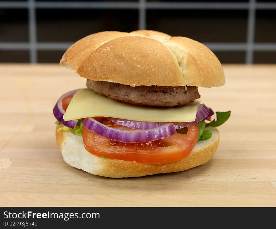 A freshly made American style hamburger with sauce