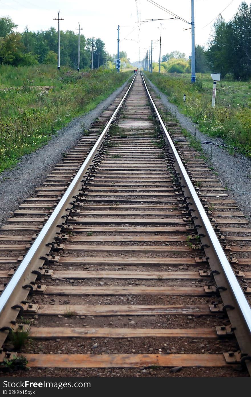 Old railroad track going straight on