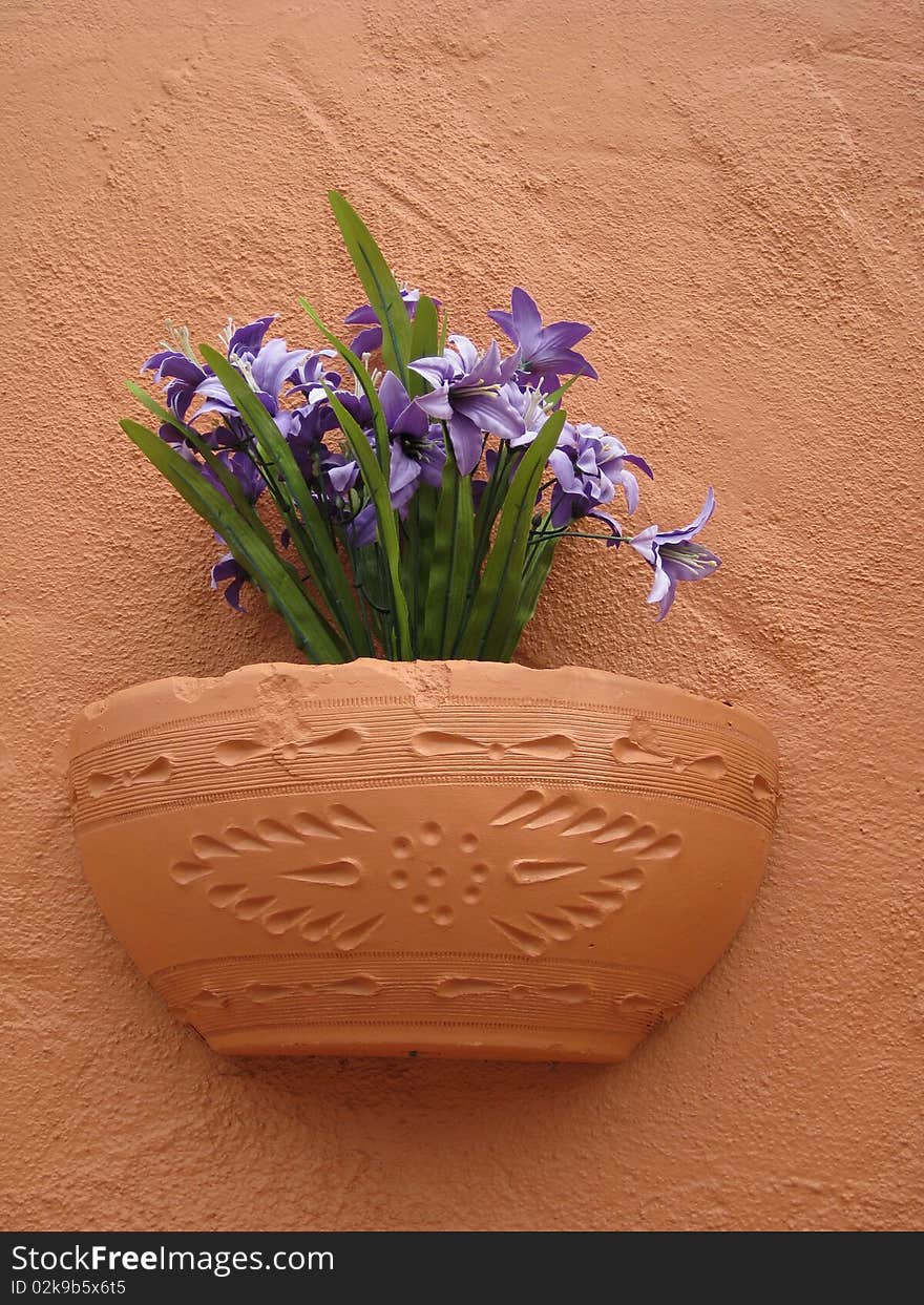 A beautiful piece of southwestern pottery with
a purple flower arrangement. A beautiful piece of southwestern pottery with
a purple flower arrangement.