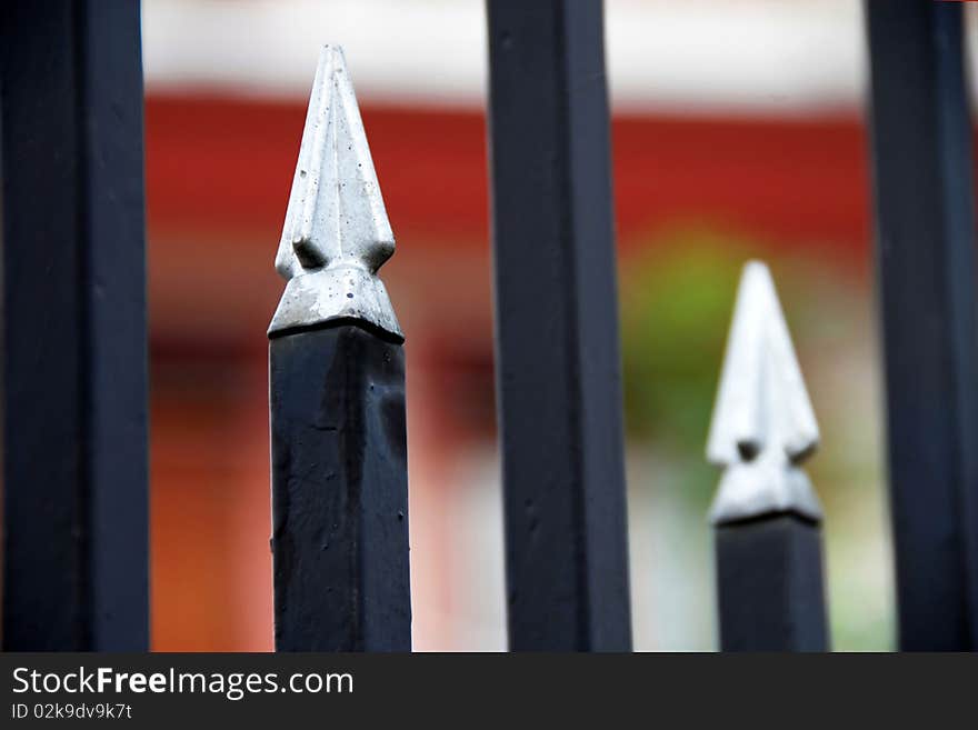 Architectural details, spires on metallic fence closeup. Architectural details, spires on metallic fence closeup