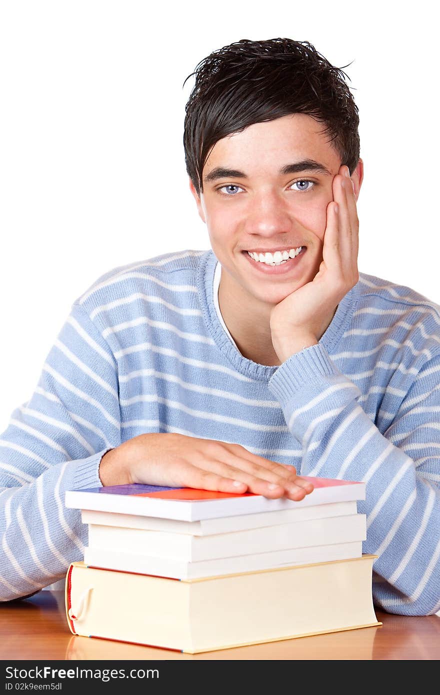 Happy Smiling Male Student On Desk With Books