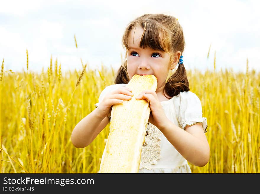 Girl eating a long loaf