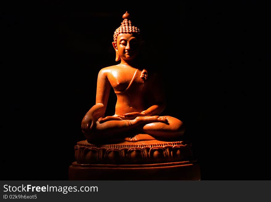 Light of Buddha image in the dark background.