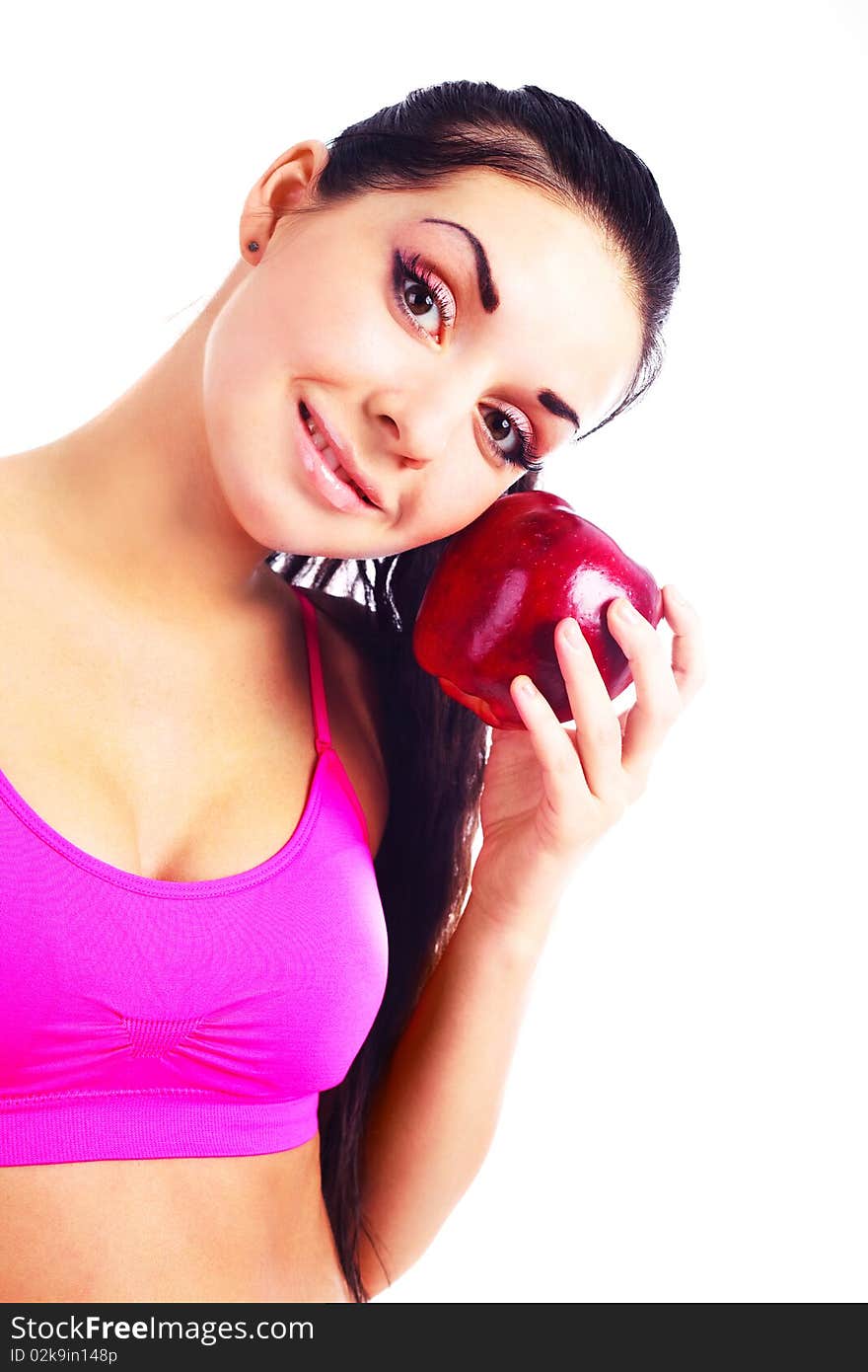 Beautiful young brunette girl eating a big red apple. Beautiful young brunette girl eating a big red apple