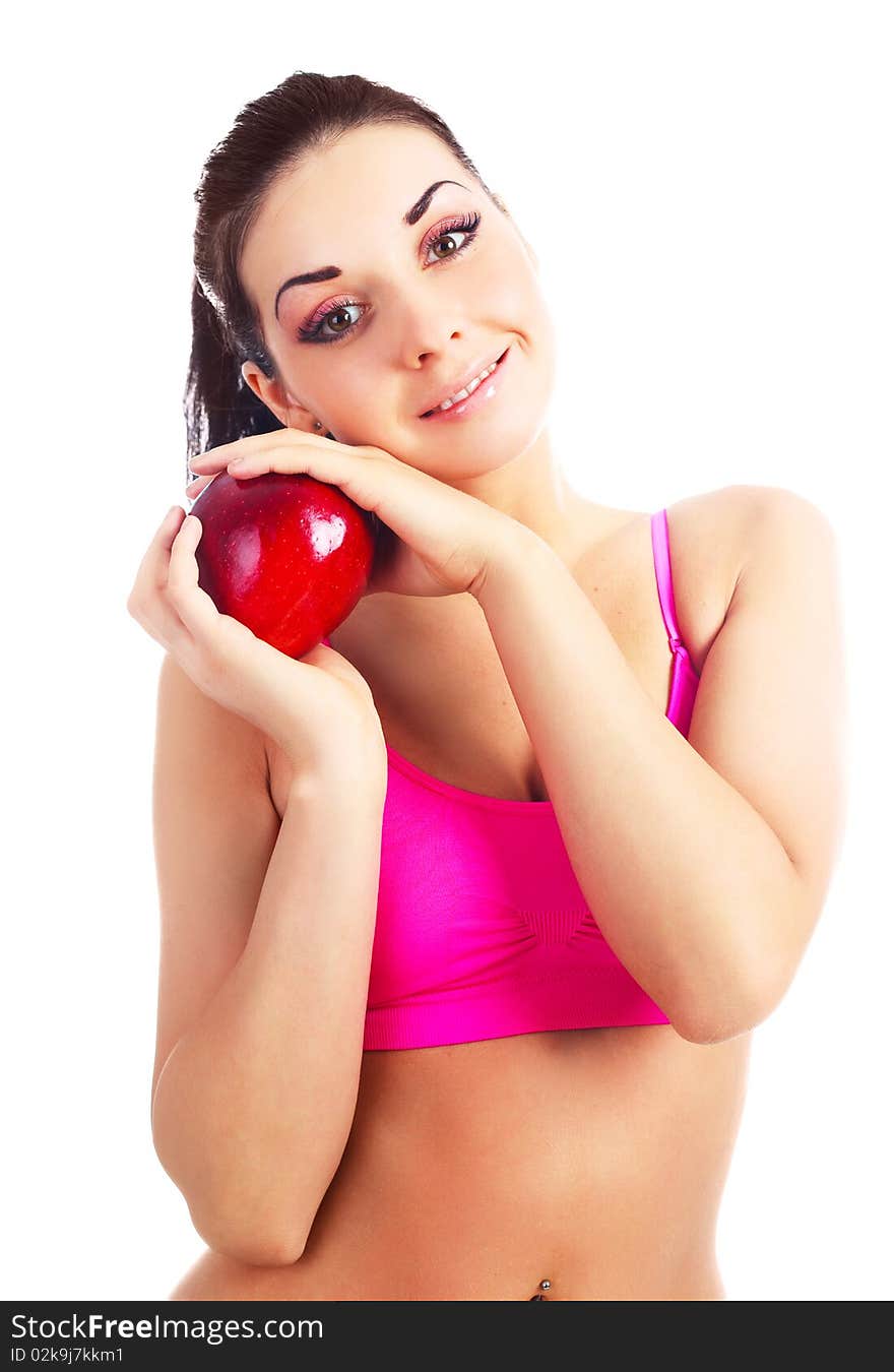 Beautiful young brunette girl eating a big red apple. Beautiful young brunette girl eating a big red apple